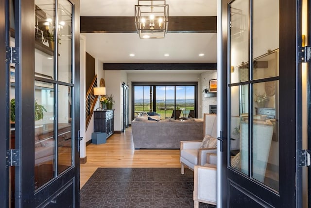 200 Miller Point Pl, Belgrade, MT 59714 - entryway featuring recessed lighting, wood finished floors, a large fireplace, and french doors