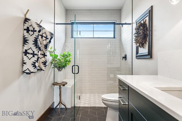 200 Miller Point Pl, Belgrade, MT 59714 - bathroom featuring a stall shower, tile patterned floors, toilet, and vanity