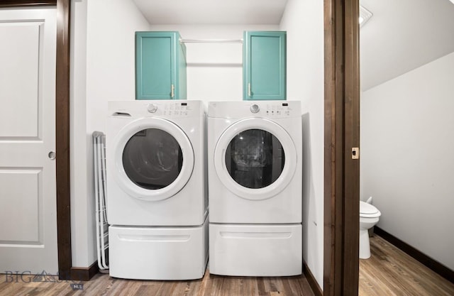705 Halfpipe St Unit B, Belgrade, MT 59714 - clothes washing area featuring washing machine and clothes dryer, wood finished floors, and baseboards