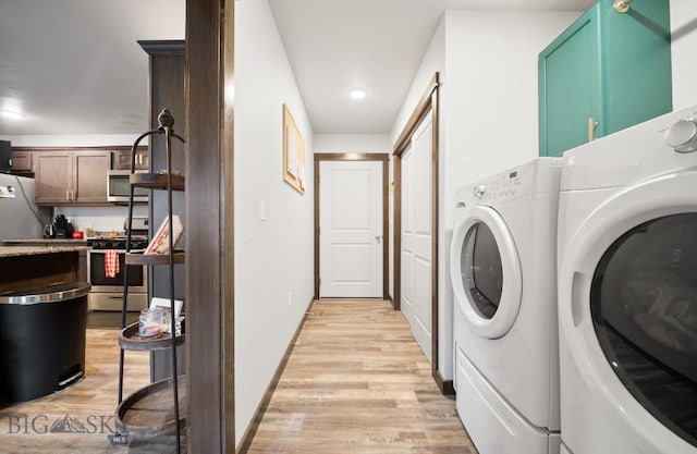 705 Halfpipe St Unit B, Belgrade, MT 59714 - laundry room with washing machine and dryer, light wood finished floors, baseboards, and recessed lighting