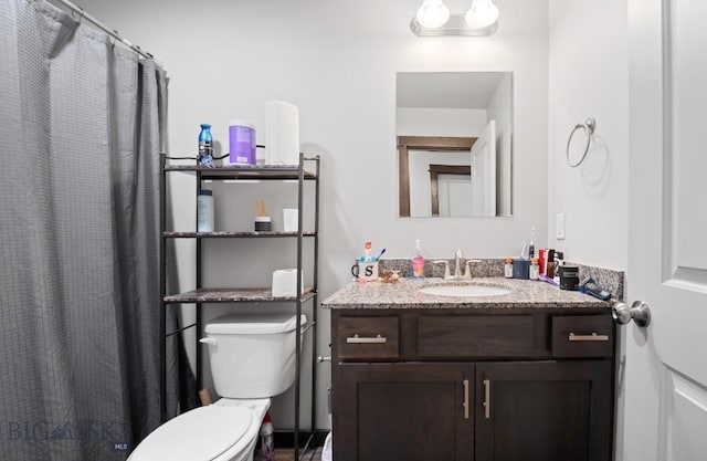 705 Halfpipe St Unit B, Belgrade, MT 59714 - bathroom featuring toilet, vanity, and a shower with curtain
