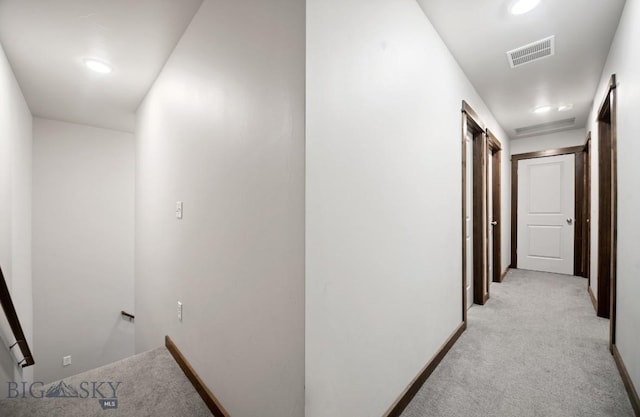 705 Halfpipe St Unit B, Belgrade, MT 59714 - hall featuring an upstairs landing, light colored carpet, and baseboards