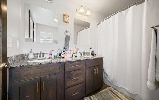 705 Halfpipe St Unit B, Belgrade, MT 59714 - full bathroom featuring double vanity and a shower with curtain