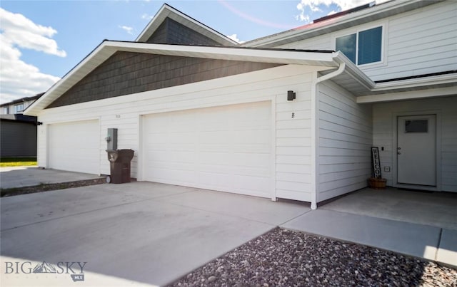 705 Halfpipe St Unit B, Belgrade, MT 59714 - view of property exterior with driveway