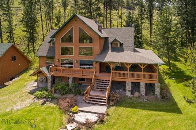 101 W Bridger Creek Rd, Big Timber, MT 59011 - rear view of property featuring a lawn, stairway, stone siding, and roof with shingles