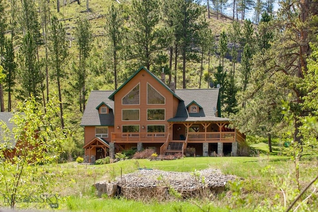 101 W Bridger Creek Rd, Big Timber, MT 59011 - back of property with stairway and a view of trees