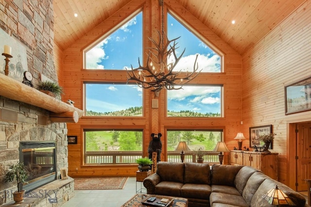101 W Bridger Creek Rd, Big Timber, MT 59011 - living room with high vaulted ceiling, wood ceiling, a chandelier, healthy amount of natural light, and wood walls