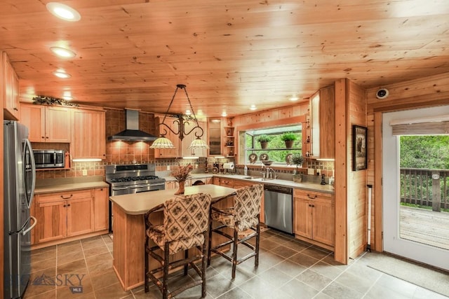 101 W Bridger Creek Rd, Big Timber, MT 59011 - kitchen featuring stainless steel appliances, wall chimney exhaust hood, wood ceiling, a center island, and healthy amount of natural light