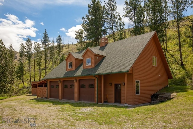 101 W Bridger Creek Rd, Big Timber, MT 59011 - view of front facade with a garage, roof with shingles, a front yard, and a chimney