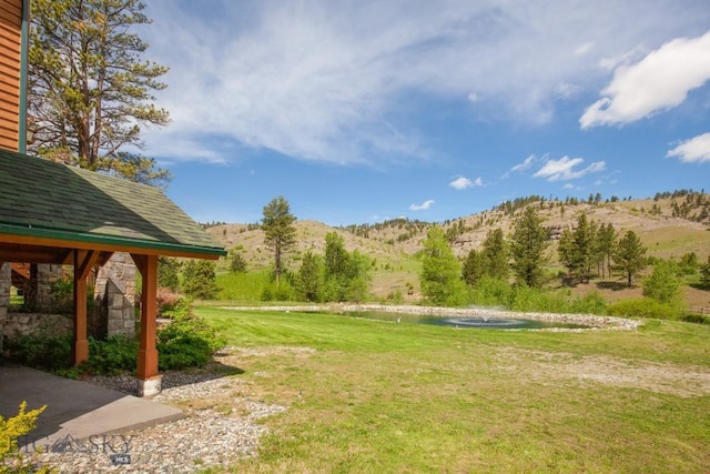 101 W Bridger Creek Rd, Big Timber, MT 59011 - view of grassy yard featuring a water and mountain view