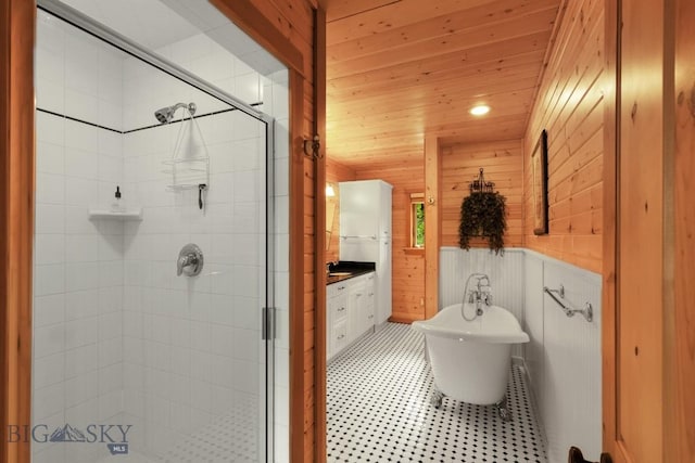 101 W Bridger Creek Rd, Big Timber, MT 59011 - bathroom with a shower stall, wooden ceiling, a freestanding bath, vanity, and wood walls