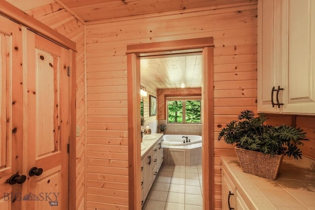 101 W Bridger Creek Rd, Big Timber, MT 59011 - bathroom featuring wooden walls, wood ceiling, a garden tub, vanity, and tile patterned flooring