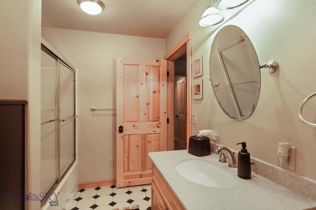 101 W Bridger Creek Rd, Big Timber, MT 59011 - full bathroom with tile patterned floors, vanity, and shower / bath combination with glass door