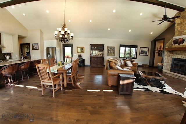 7 N Lewis And Clark Trl, Whitehall, MT 59759 - dining space featuring a fireplace, high vaulted ceiling, a chandelier, beam ceiling, and dark wood-style flooring