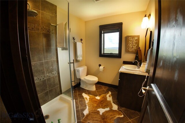 7 N Lewis And Clark Trl, Whitehall, MT 59759 - bathroom featuring vanity, a tile shower, and tile patterned floors