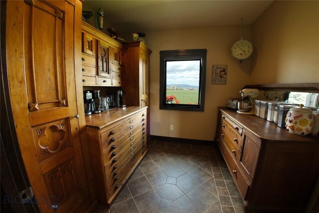 7 N Lewis And Clark Trl, Whitehall, MT 59759 - kitchen with brown cabinetry and dark tile patterned floors