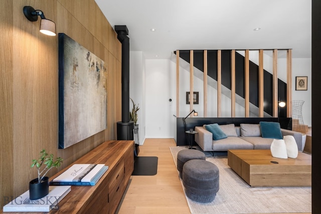living area featuring light wood-style floors and stairway