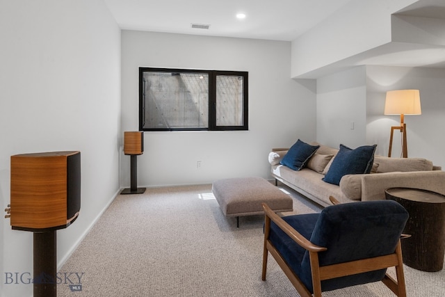 carpeted living room featuring recessed lighting and baseboards