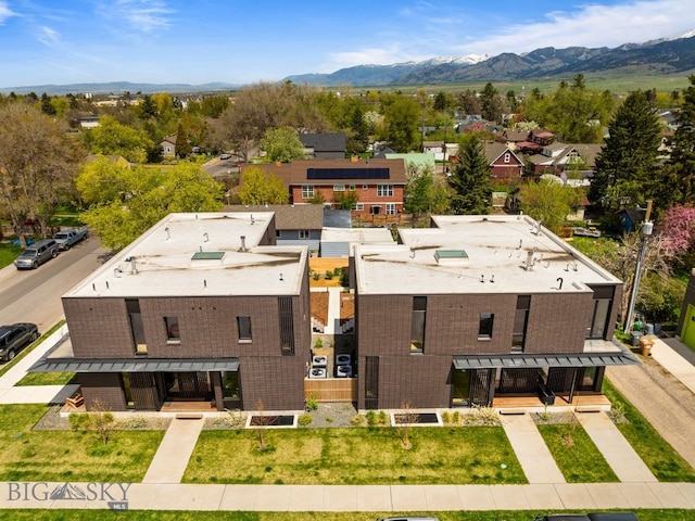 aerial perspective of suburban area featuring a mountain backdrop
