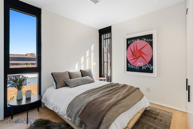bedroom with wood finished floors