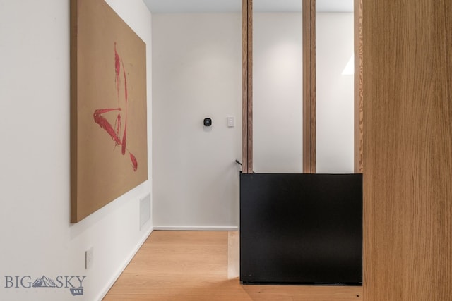 hallway featuring light wood-type flooring