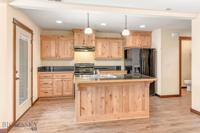 kitchen featuring light brown cabinetry, a sink, under cabinet range hood, black refrigerator with ice dispenser, and light wood-type flooring