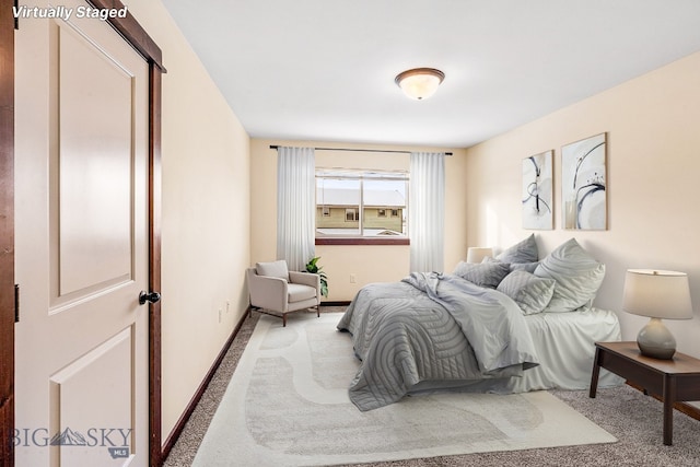 carpeted bedroom featuring baseboards