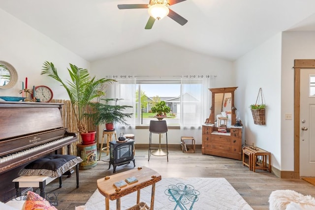 182 Snowy Owl Trl, Bozeman, MT 59718 - living area with healthy amount of natural light, vaulted ceiling, wood finished floors, ceiling fan, and baseboards
