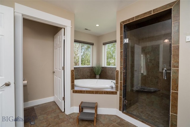 508 Coral Dr, Belgrade, MT 59714 - full bath with a bath, a shower stall, baseboards, and recessed lighting