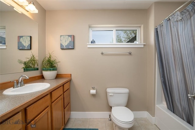 508 Coral Dr, Belgrade, MT 59714 - bathroom with vanity, baseboards, tile patterned flooring, toilet, and shower / bath combination with curtain