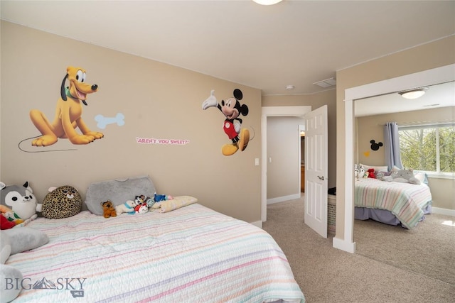 508 Coral Dr, Belgrade, MT 59714 - carpeted bedroom featuring baseboards