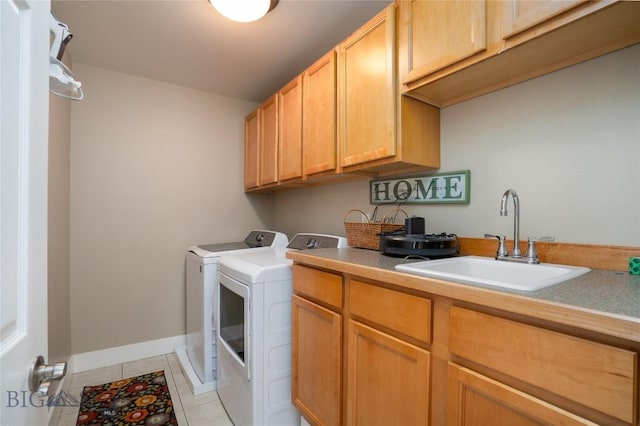 508 Coral Dr, Belgrade, MT 59714 - washroom with cabinet space, washer and dryer, light tile patterned flooring, and baseboards