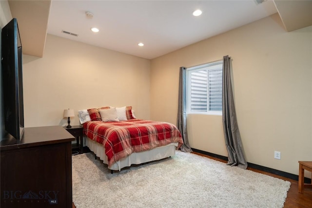508 Coral Dr, Belgrade, MT 59714 - bedroom featuring wood finished floors, recessed lighting, and baseboards