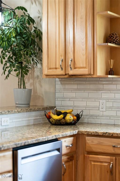 508 Coral Dr, Belgrade, MT 59714 - kitchen featuring stainless steel dishwasher, backsplash, light stone counters, and open shelves