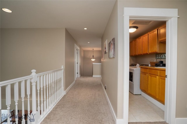 508 Coral Dr, Belgrade, MT 59714 - hallway featuring washer / clothes dryer, recessed lighting, baseboards, and light colored carpet