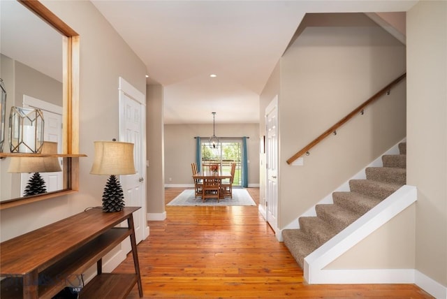 508 Coral Dr, Belgrade, MT 59714 - entryway with stairs, light wood finished floors, baseboards, and a chandelier