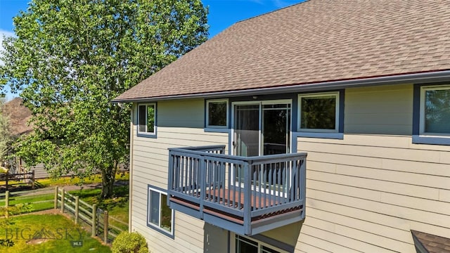 508 Coral Dr, Belgrade, MT 59714 - rear view of property featuring a shingled roof and a deck