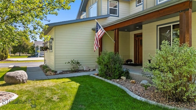 508 Coral Dr, Belgrade, MT 59714 - view of exterior entry with a lawn
