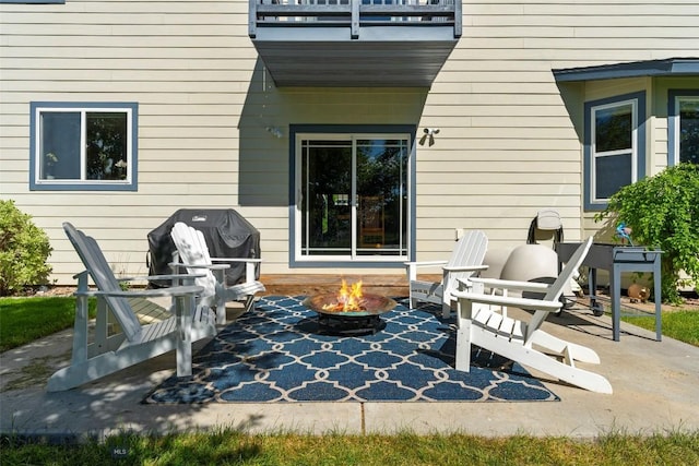 508 Coral Dr, Belgrade, MT 59714 - view of patio with a balcony, a fire pit, and area for grilling