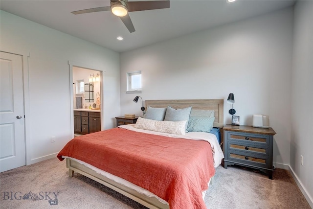 bedroom with carpet flooring, recessed lighting, baseboards, ensuite bathroom, and a ceiling fan