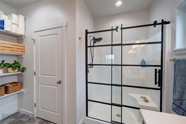 36 Sante Fe, Three Forks, MT 59752 - bathroom featuring a stall shower, recessed lighting, baseboards, and wood finished floors