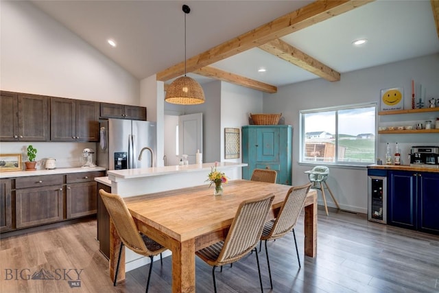 36 Sante Fe, Three Forks, MT 59752 - dining area featuring beverage cooler, a bar, light wood-type flooring, recessed lighting, and baseboards