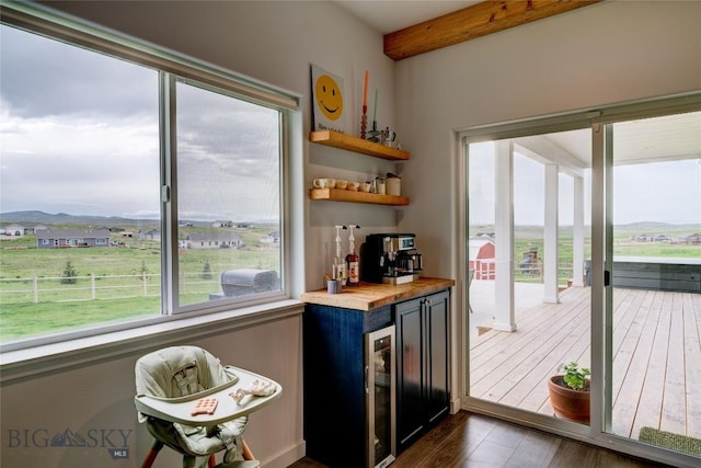 36 Sante Fe, Three Forks, MT 59752 - indoor dry bar featuring dark wood-style flooring, wine cooler, and beam ceiling