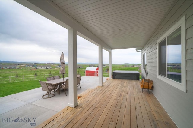 36 Sante Fe, Three Forks, MT 59752 - deck featuring a covered hot tub, outdoor dining area, and a patio area