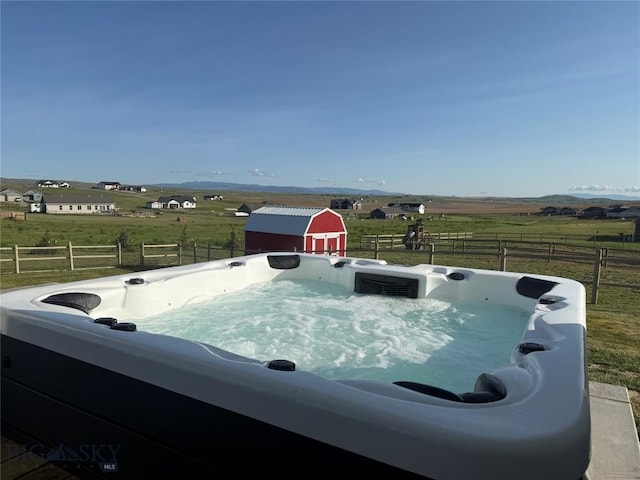 36 Sante Fe, Three Forks, MT 59752 - view of swimming pool with a hot tub, a view of countryside, and a storage unit