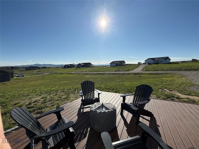 36 Sante Fe, Three Forks, MT 59752 - wooden terrace featuring a view of rural / pastoral area and a yard