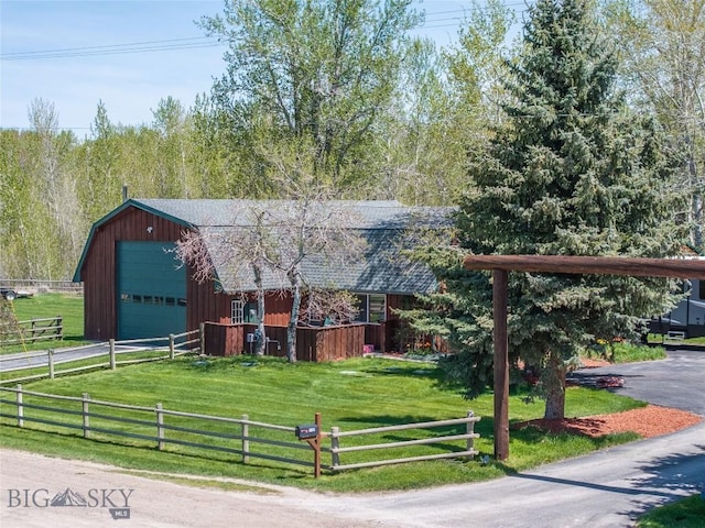 9704 River Rd, Bozeman, MT 59718 - view of front of home with a gambrel roof, an outbuilding, a garage, roof with shingles, and driveway