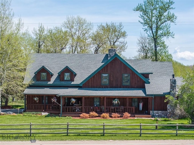9704 River Rd, Bozeman, MT 59718 - view of front of home featuring a porch, a shingled roof, and a chimney