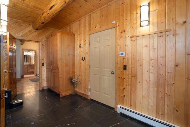 9704 River Rd, Bozeman, MT 59718 - foyer entrance with baseboard heating, wood ceiling, beamed ceiling, and wood walls
