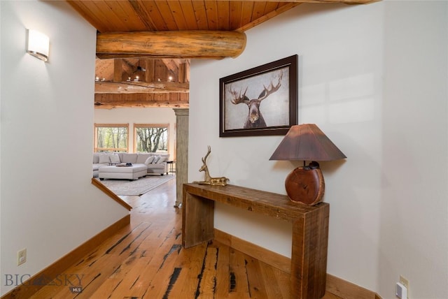 9704 River Rd, Bozeman, MT 59718 - hallway with wooden ceiling, wood-type flooring, beamed ceiling, and baseboards